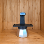 A Black Gemini Express moka pot centered against a wooden background.