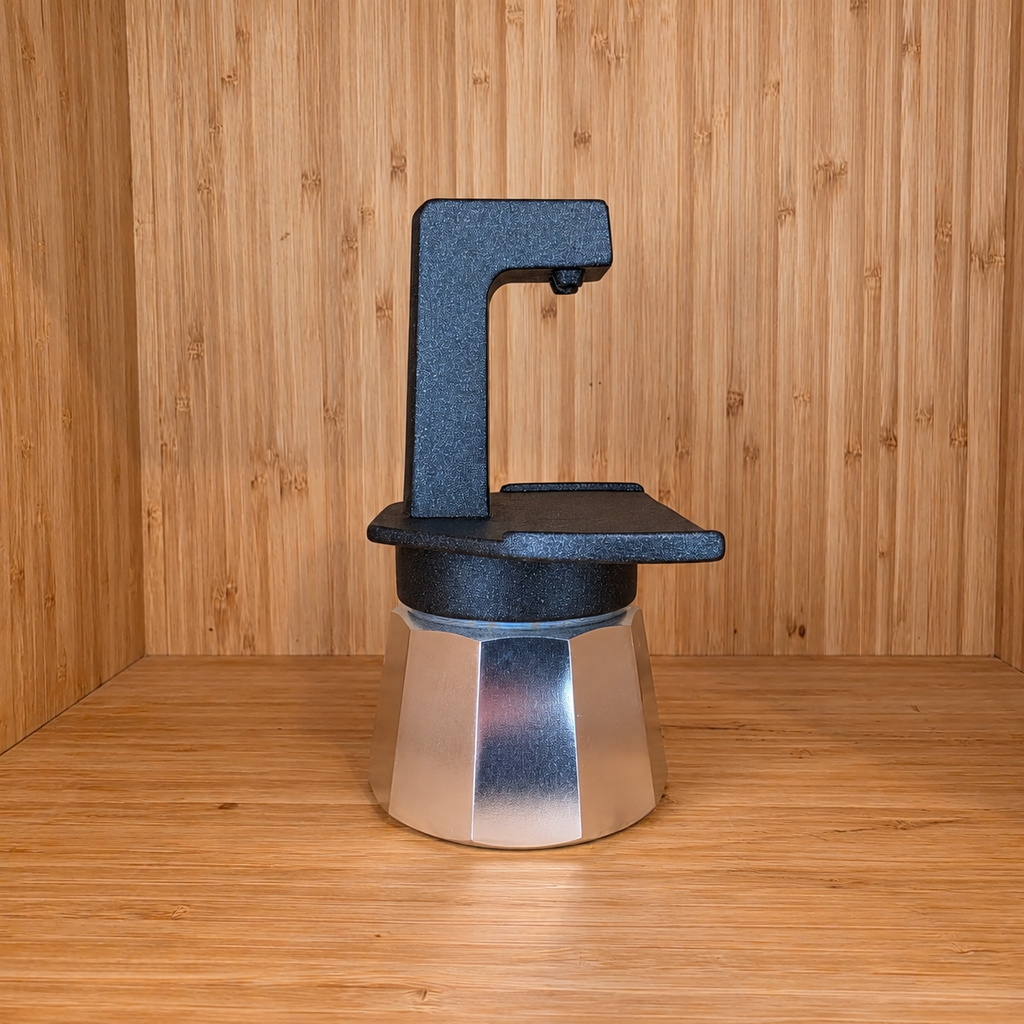 A Black Gemini Express moka pot side view against a wooden background.