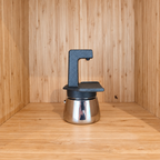 A Black Gemini Express moka pot side view against a wooden background.